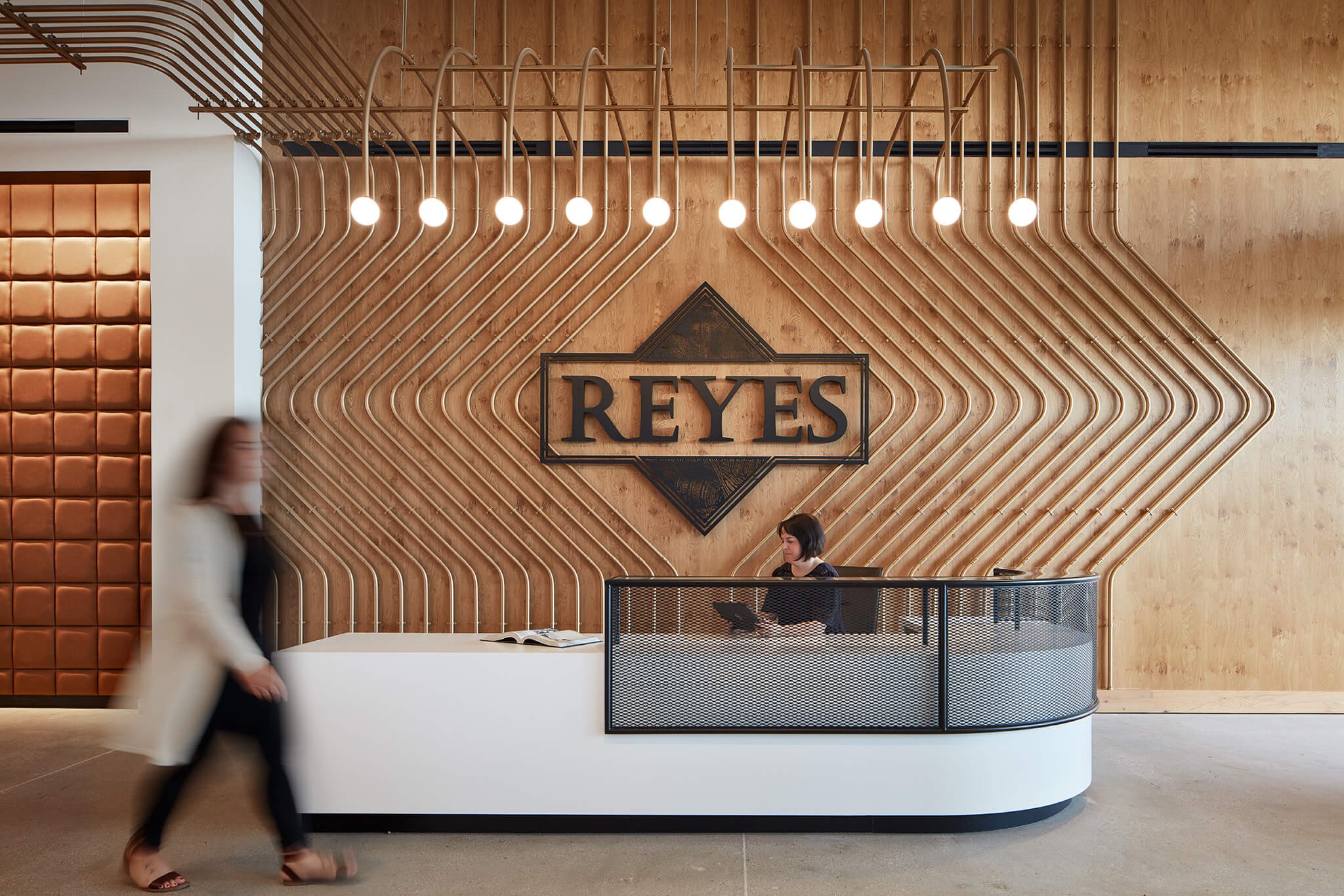 Front desk reception area with Reyes Beverage Group sign.