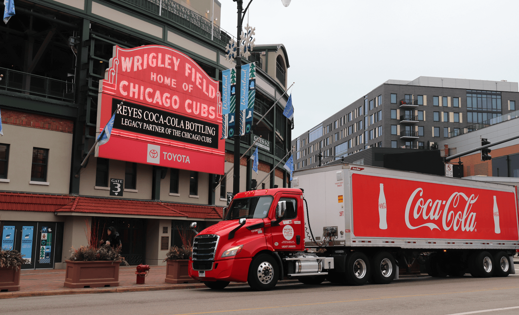 RCCB truck parked in front of Wrigley field sign