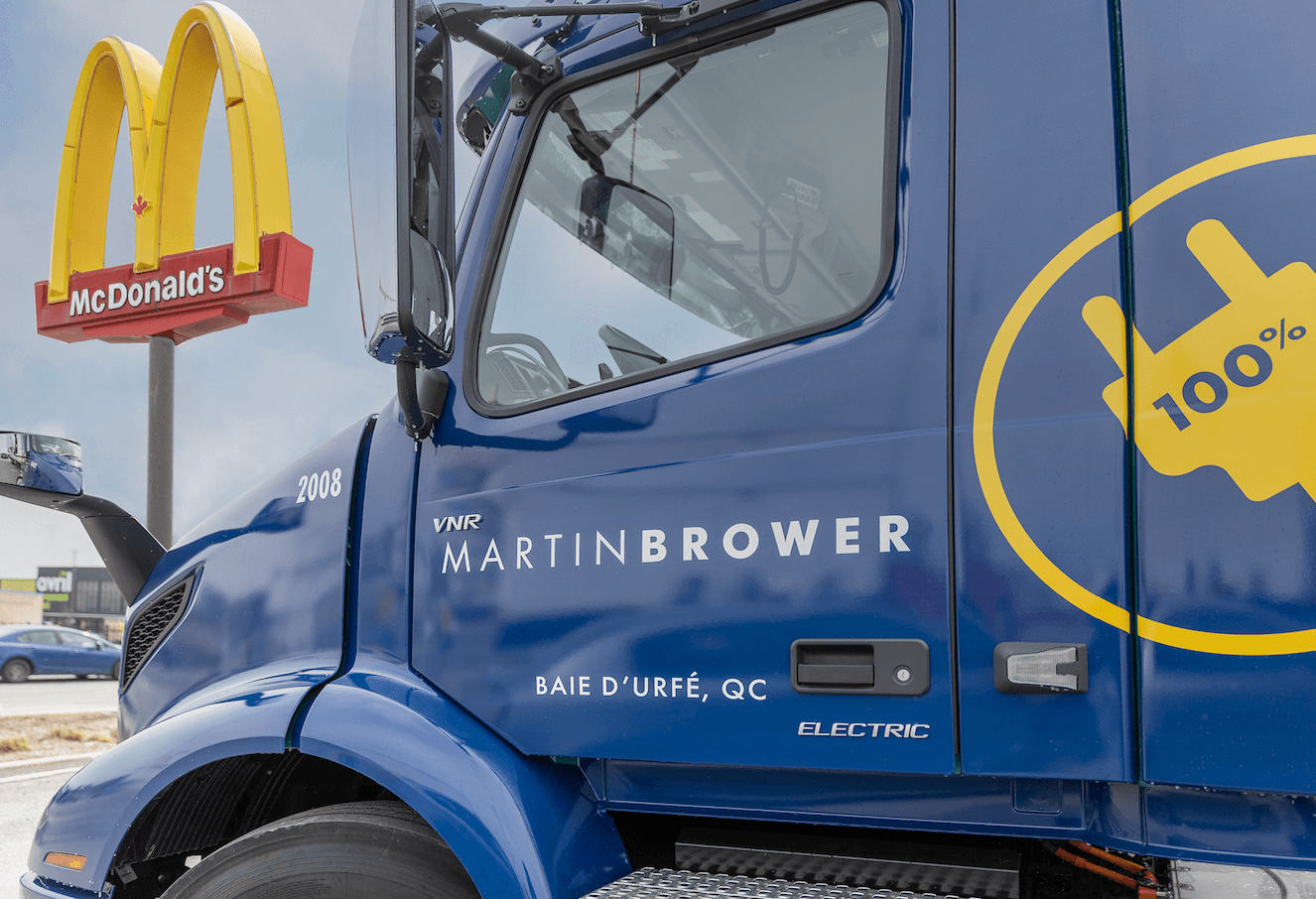 Martin Brower electric truck with McDonald's sign in the background